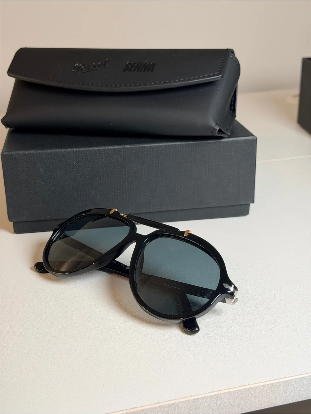 Persol Polarized Sienna Black Sunglasses with Gold Accents and Dark Lenses